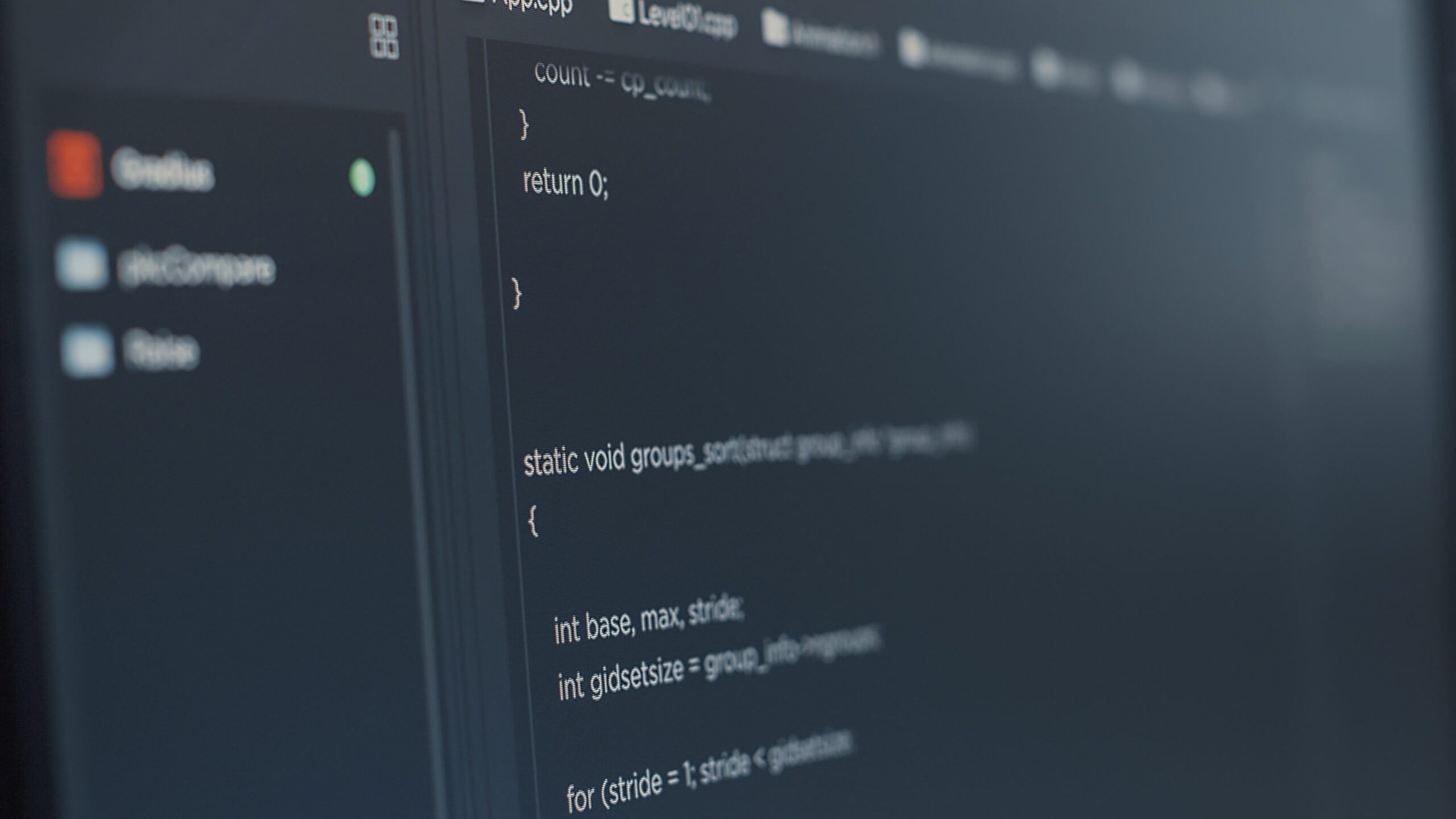 Closeup of computer screen of software developer typing programming language